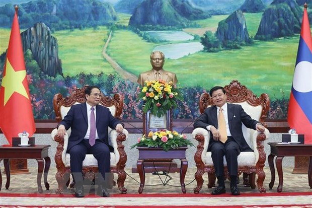 Thủ tướng Phạm Minh Chính hội kiến Tổng Bí thư, Chủ tịch nước Lào Thongloun Sisoulith. (Ảnh: Dương Giang/TTXVN).